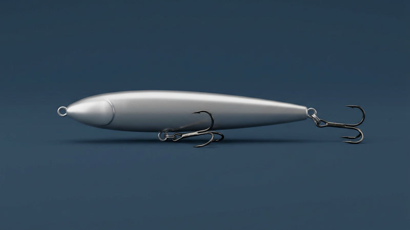 Generic category illustration of slender silver lipless pencil lure, on a plain dark navy background