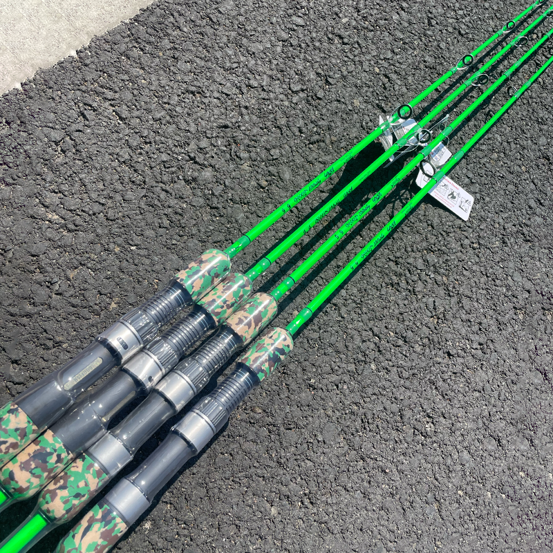 Green GOOFISH Ares rods with camouflage grips, reel seats and guide layouts arranged on pavement