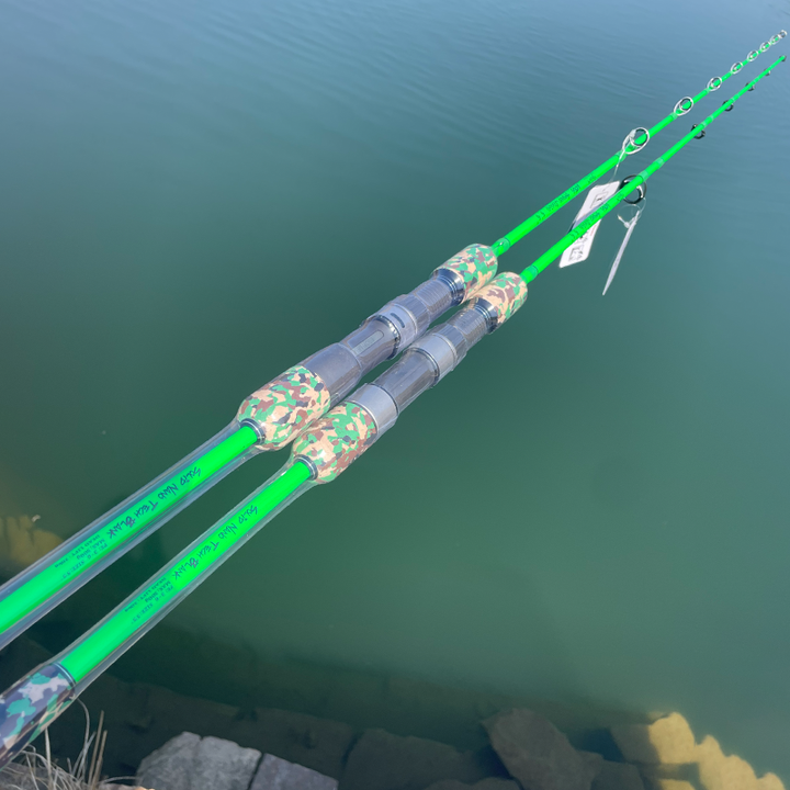 Two green GOOFISH Ares rods with camouflage grips and different guide layouts held above water