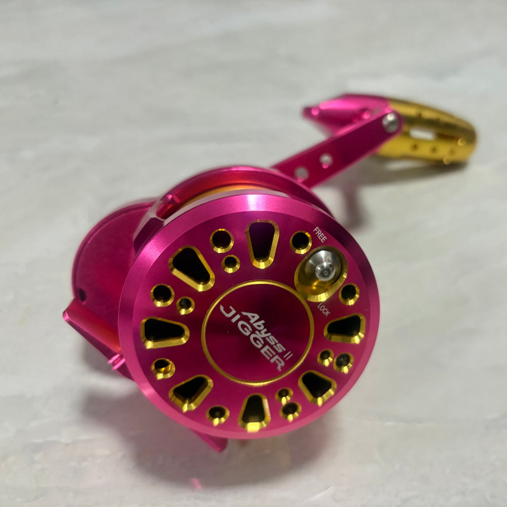 pink goofish abyss jigger gen 2 saltwater jigging  reels